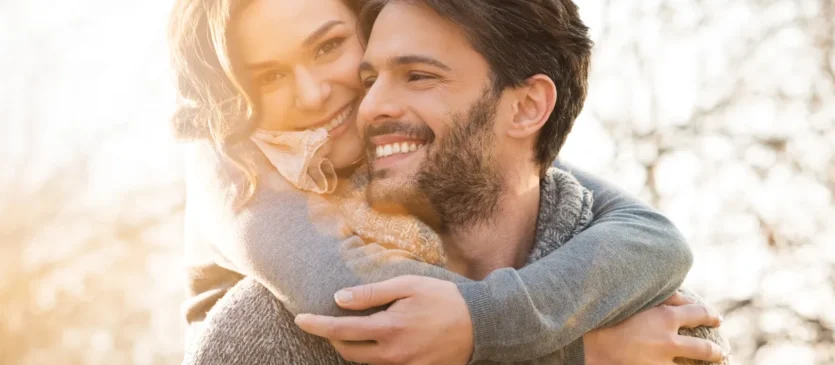 Girl Hugging Boyfriend With Perfect Smile
